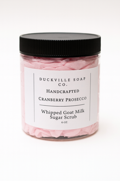 Whipped goat milk sugar scrub jar, Cranberry Prosecco label, black lid, pink flakes