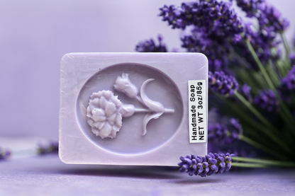 Lavender soap bar with duck-face relief in a molded circular shape