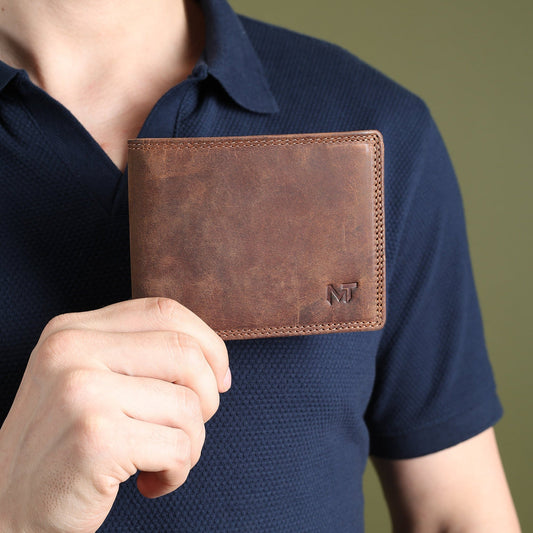 Men's leather wallet in brown with stitched edge and small MT logo on the front