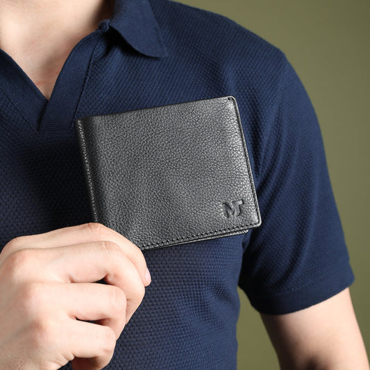 Black textured leather wallet with stitched edges and embossed M logo