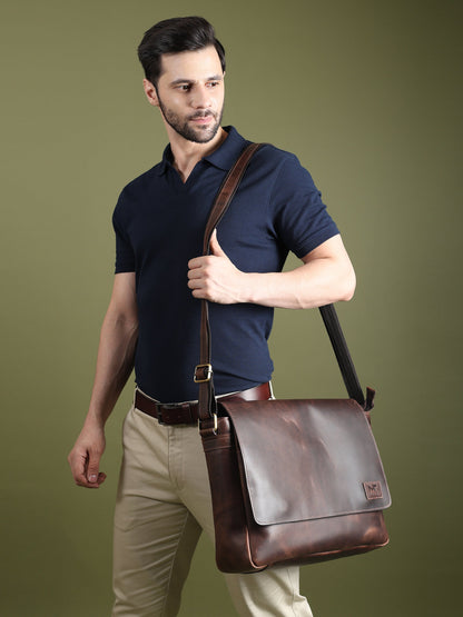 Brown leather laptop messenger bag with shoulder strap and front flap
