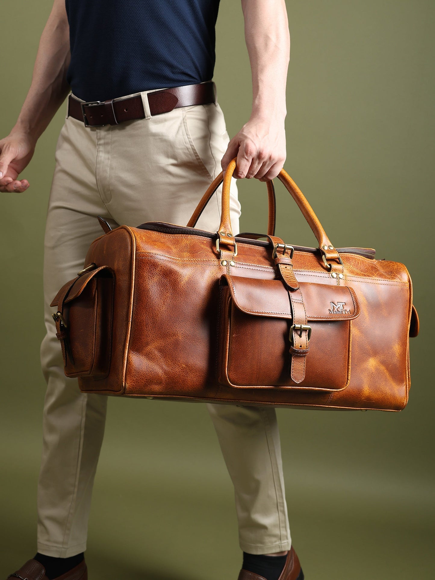 Berlin leather weekender duffle bag in brown leather with long shoulder strap and front pocket