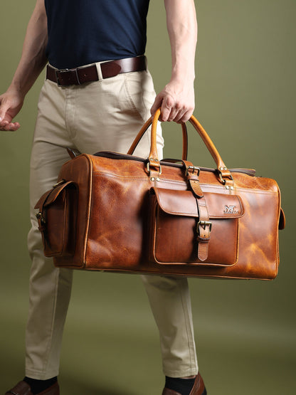 Berlin leather weekender duffle bag in brown leather with long shoulder strap and front pocket