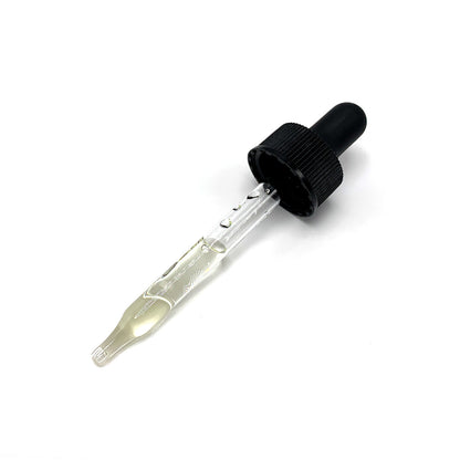 Organic beard oil dropper bottle with black cap and glass pipette, amber liquid.
