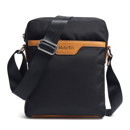 Black canvas side messenger bag with tan-trimmed front flap detail and adjustable strap