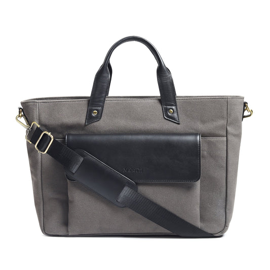 Gray canvas leather briefcase with top handles, front flap, and shoulder strap.