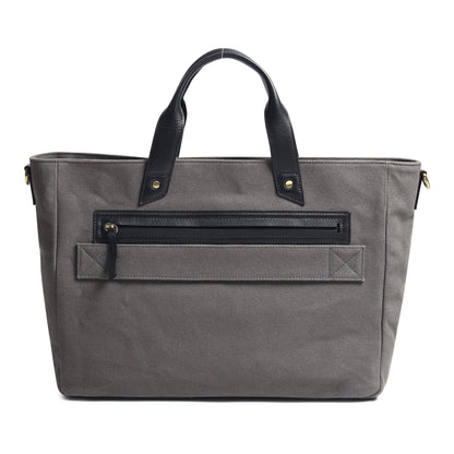 Gray canvas leather briefcase with zippered back organizer pocket and top handles.