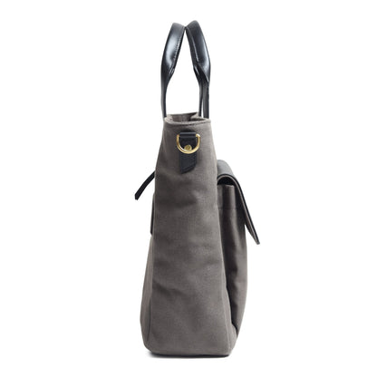 Gray canvas leather briefcase with top handle and hanging fabric pull tabs.