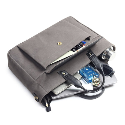 Gray canvas leather briefcase with flap front, inner compartments, and metal key ring.
