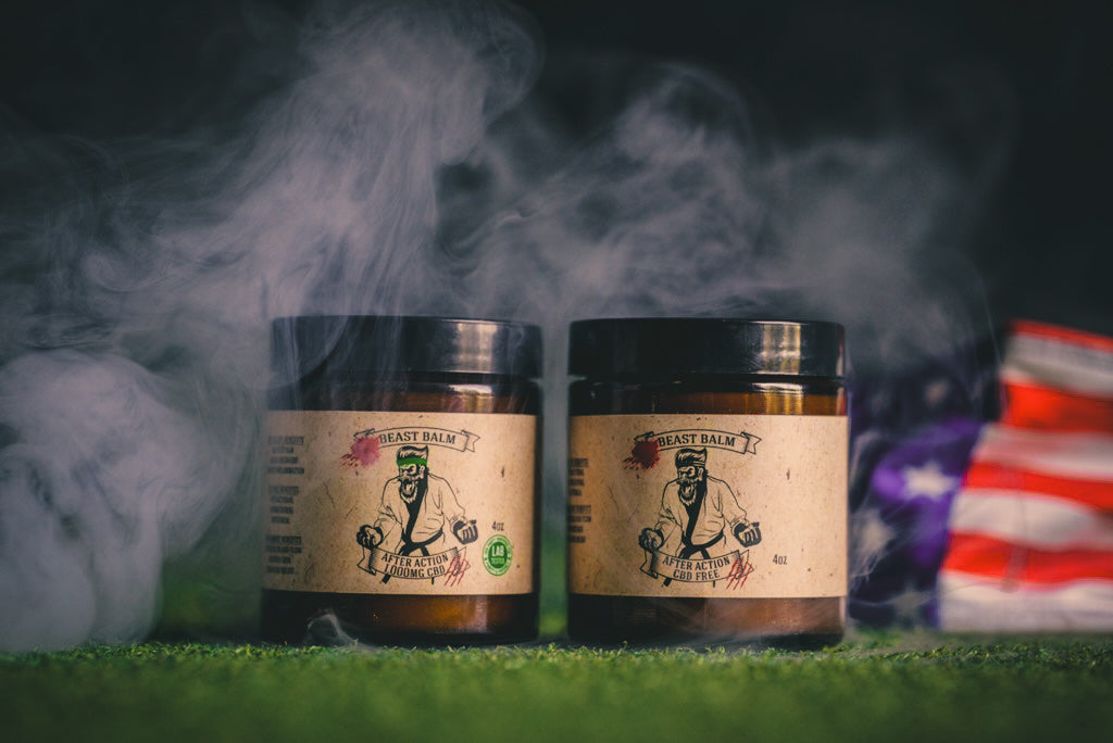 Two hemp-free beast balm jars with black lids and beige labels.