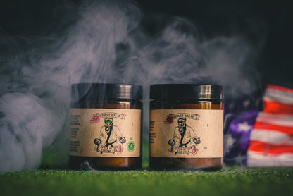 Two hemp-free beast balm jars with black lids and beige labels.