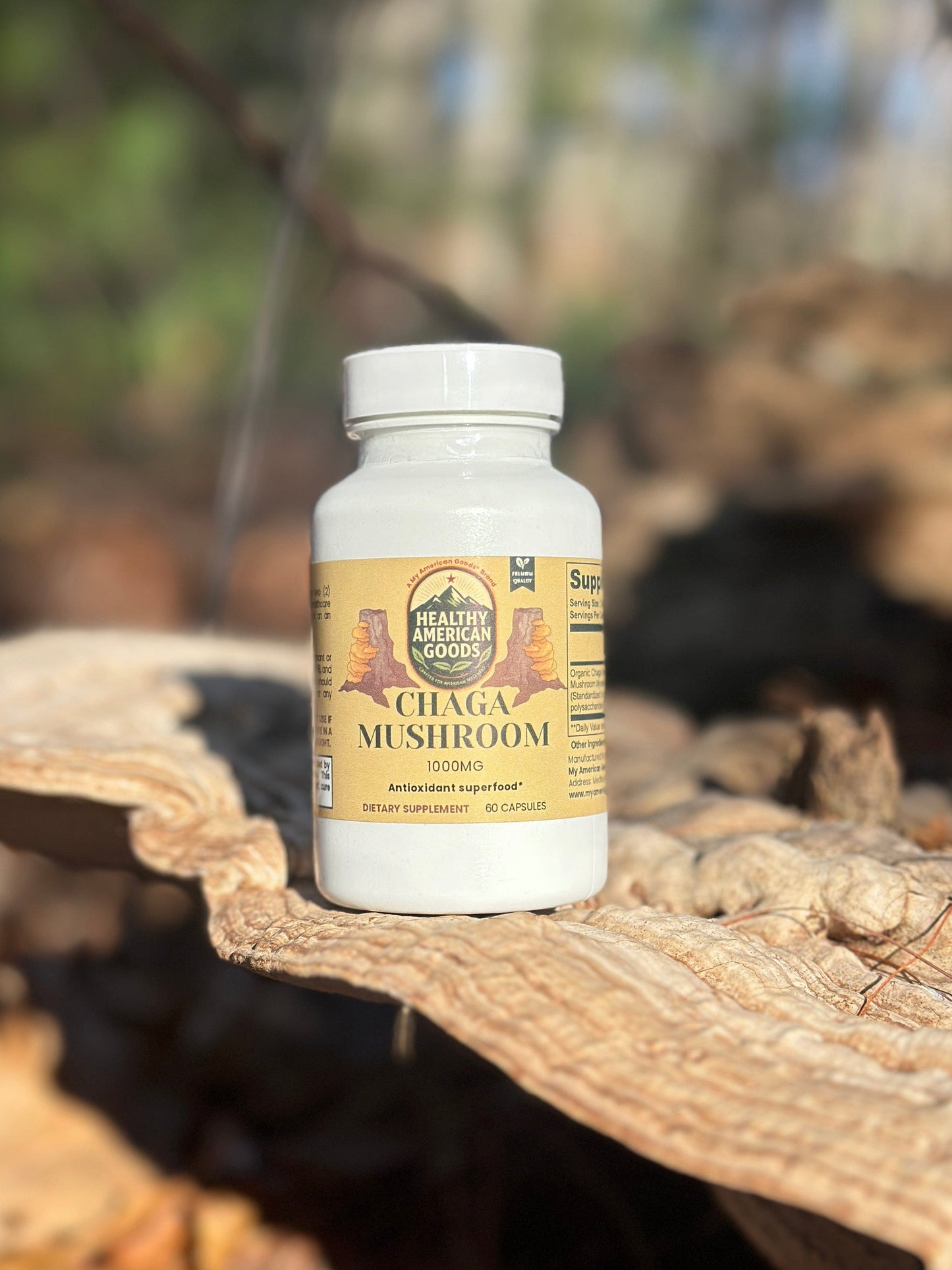 Chaga mushroom supplement bottle on a wooden surface with white cap and label.