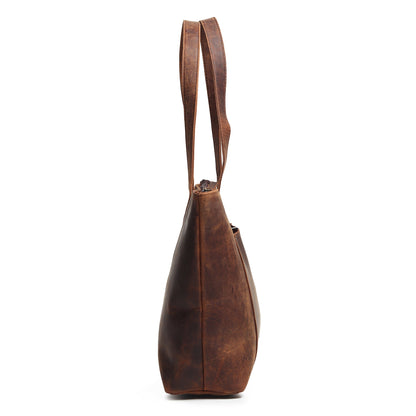 Brown leather tote bag side view with narrow base and top handles