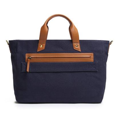 Dark blue canvas briefcase with tan leather top handles and front zip organizer panel