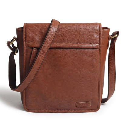 Brown leather crossbody bag with front flap and adjustable shoulder strap