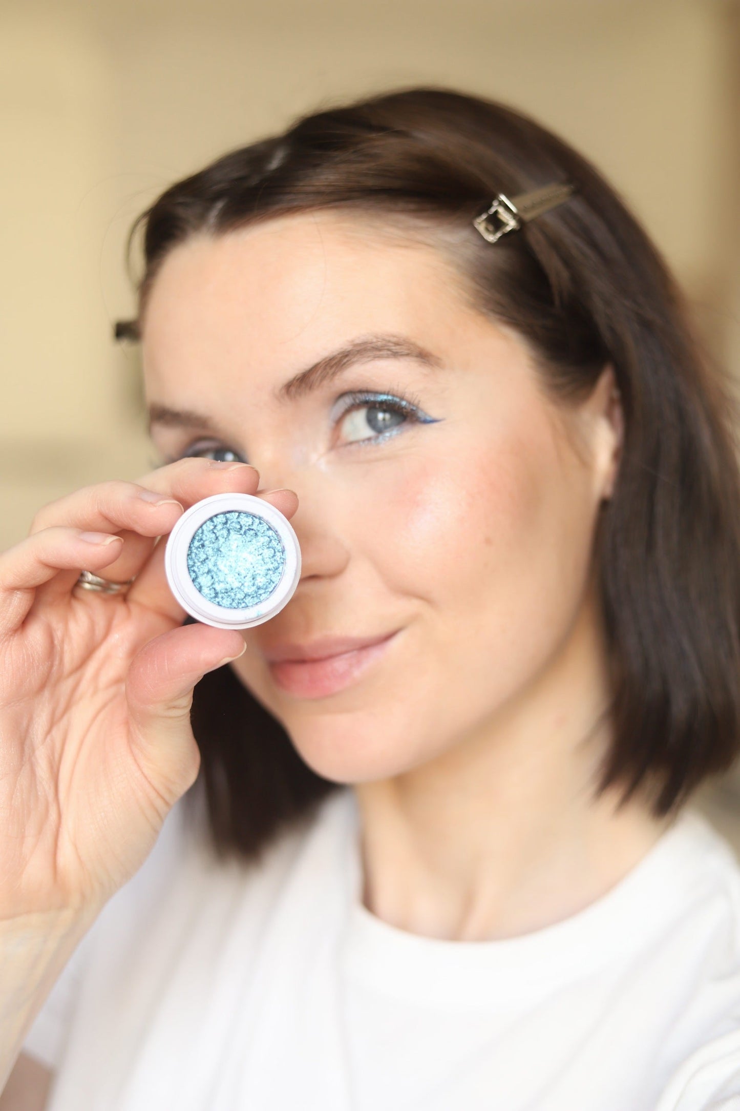 Eyeshadow compact with light blue shimmery powder