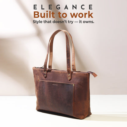 Large brown leather tote bag with top handles and front slip pocket