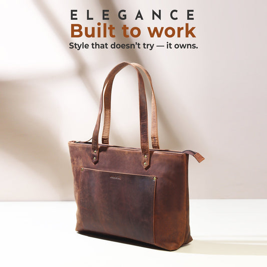 Large brown leather tote bag with top handles and front slip pocket