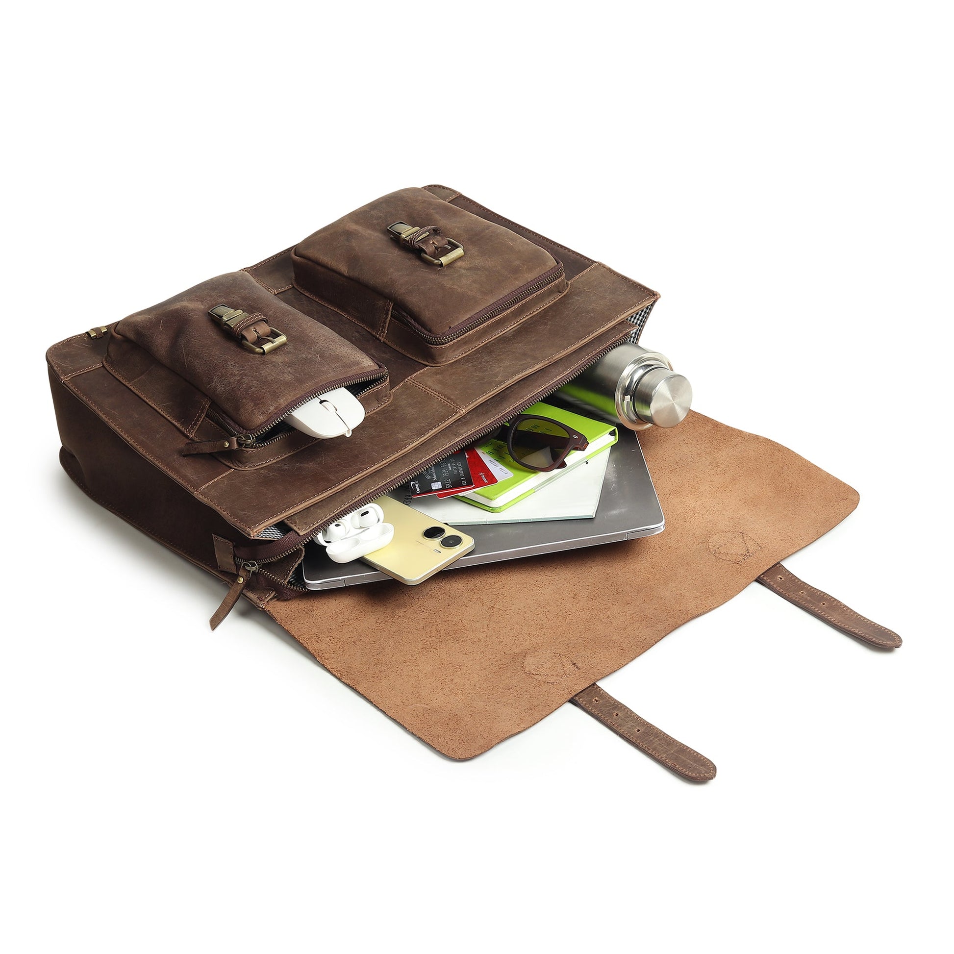 Brown buffalo leather messenger bag with flap open, gear inside, and matching leather document cover.