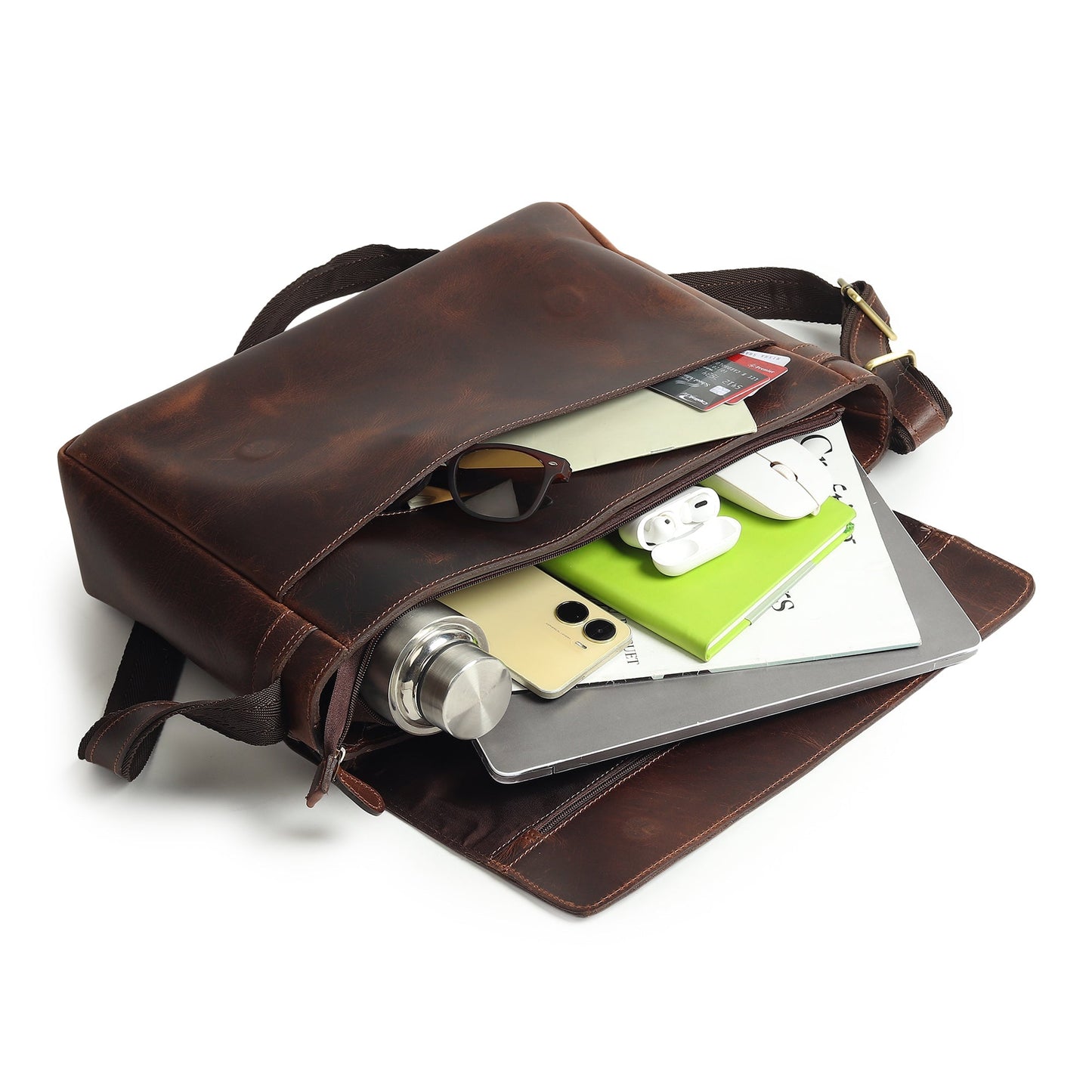 Brown leather laptop bag with open flap showing organizer compartments