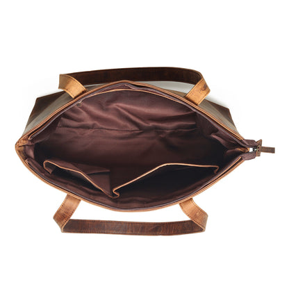 Brown leather tote bag interior view with open top and lined interior