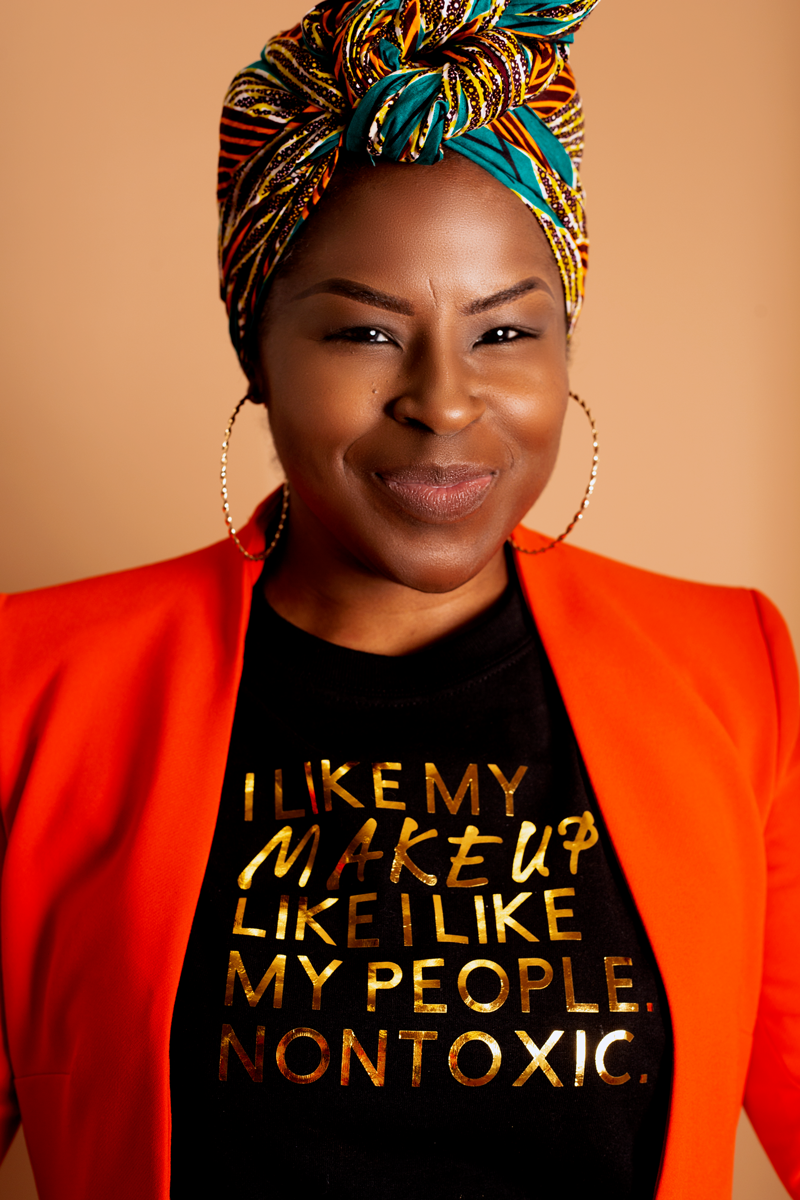 Black graphic slogan T-shirt with colorful "I LIKE MY MAKEUP" text