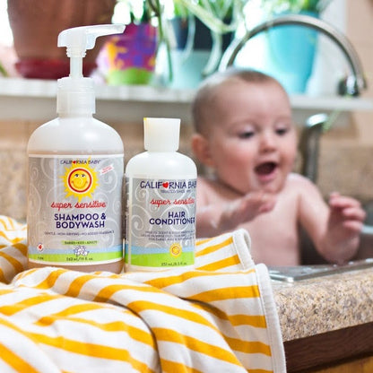 Super sensitive shampoo and hair conditioner pump bottles on bathroom sink