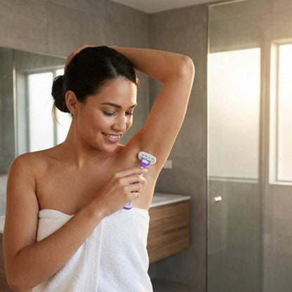 Women's cartridge razor in use, purple handle held near underarm