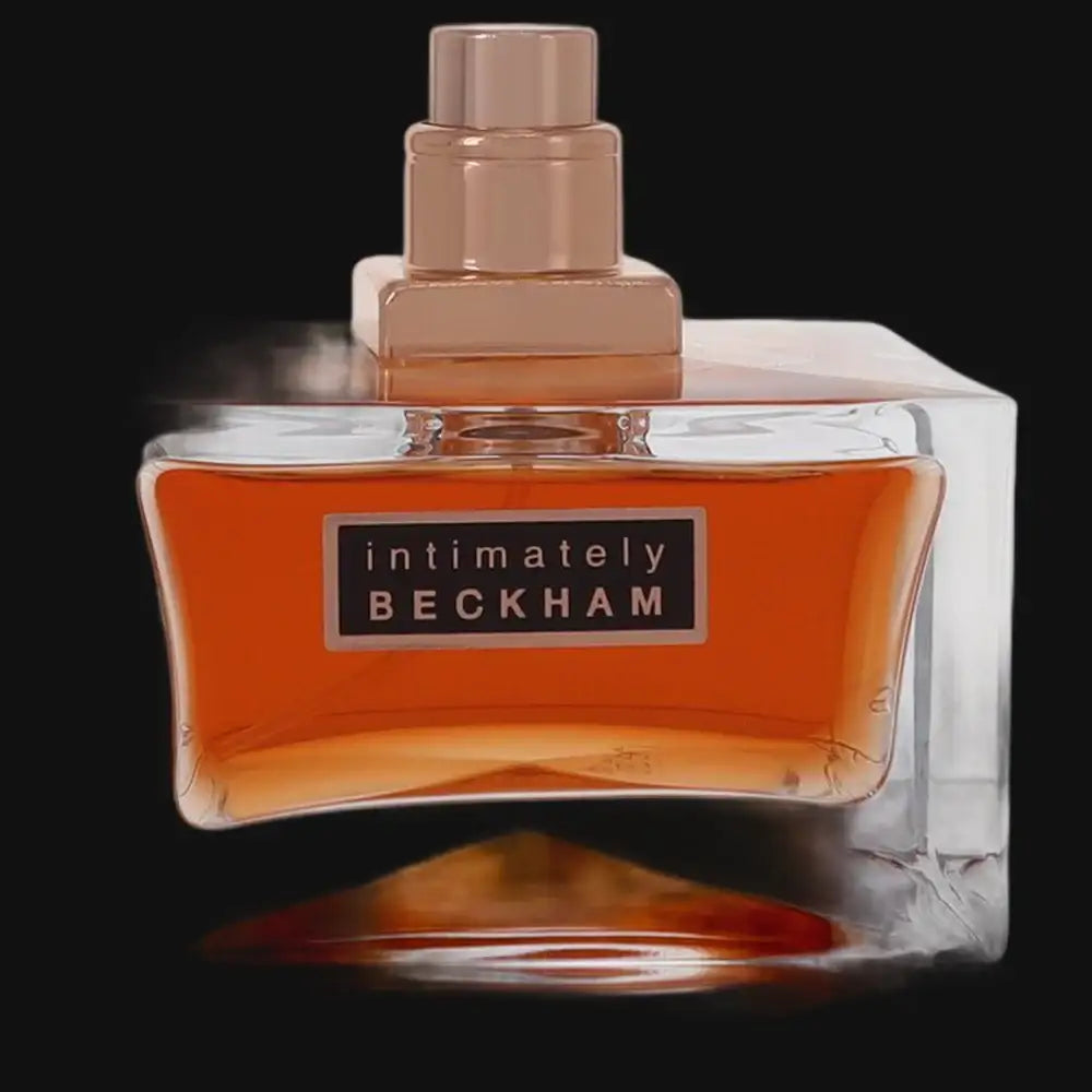 Intimately Beckham men's cologne bottle with amber liquid and rose-gold cap