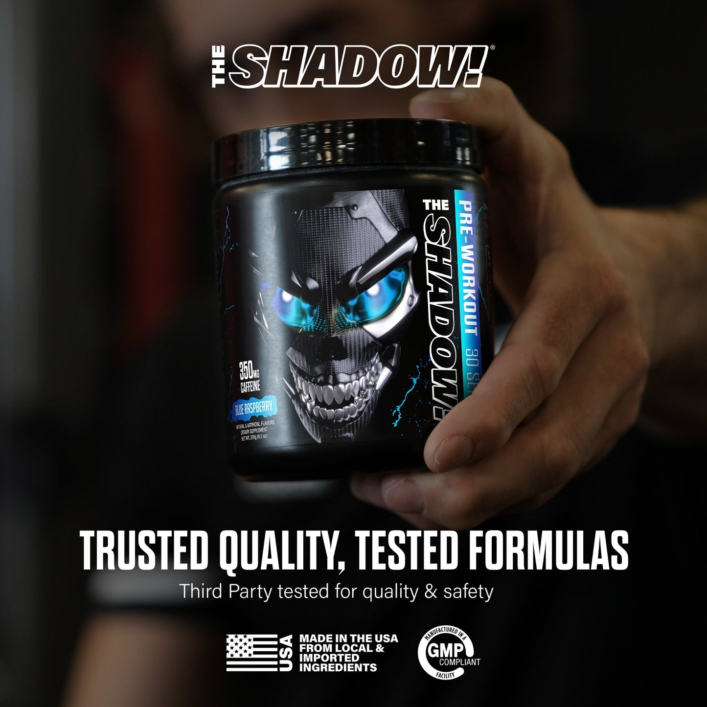 Pre-workout supplement tub with blue skull eyes held in hand; trusted quality badge