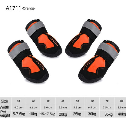 Orange reflective dog boots with black and gray bands, orange interior, traction outsole.