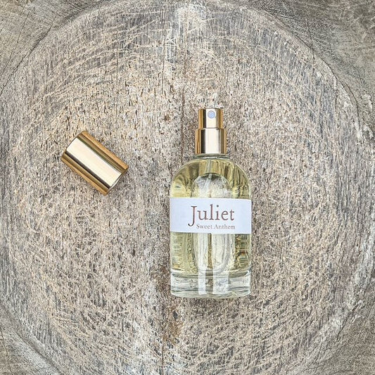 Sweet Anthem eau de parfum bottle with gold cap and Juliet label