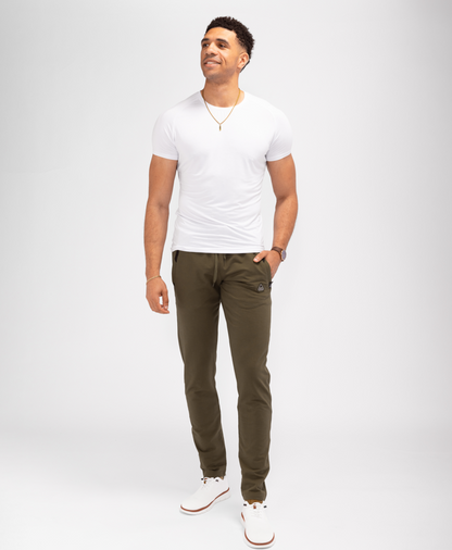 Tapered athletic sweatpants in dark olive green, elastic waistband with drawstring, side pockets.
