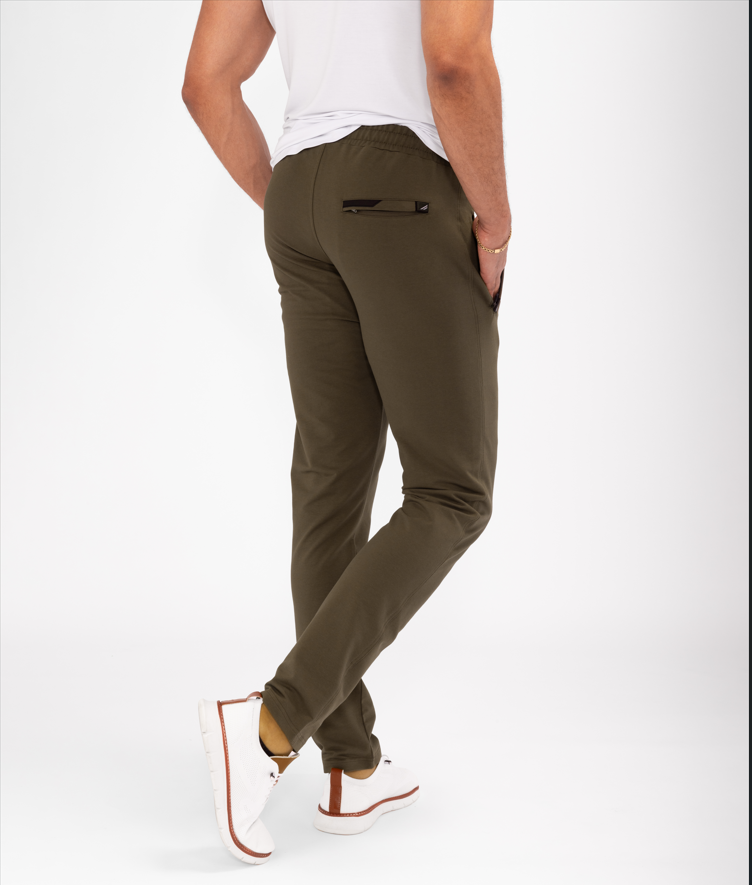 Olive tapered athletic sweatpants with elastic waistband and zippered side pockets