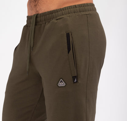 Olive tapered sweatpants with zip pocket, drawcord waist, and brand patch detail