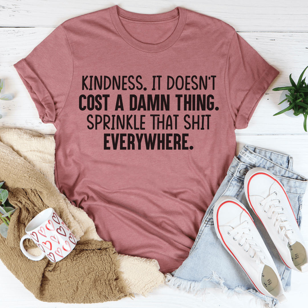 Mauve crewneck t-shirt with black "KINDNESS" slogan graphic