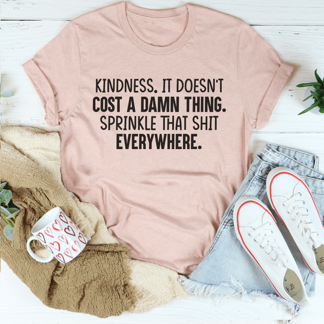 Mauve T-shirt with black crew neck and 'Kindness...everywhere' front slogan.