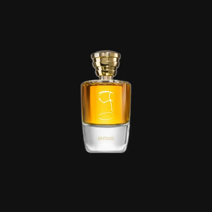 Unisex fragrance bottle with gold cap and amber liquid, clear glass base and label
