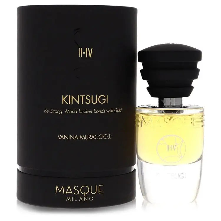 Unisex fragrance bottle with black cap and amber liquid beside product box