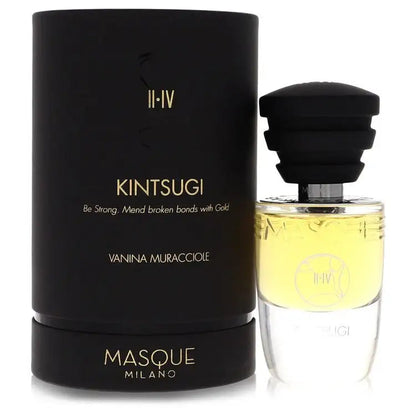 Unisex fragrance bottle with black cap and amber liquid beside product box
