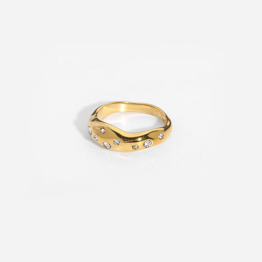 Gold snake-shape ring with small clear stones, wide band, front view