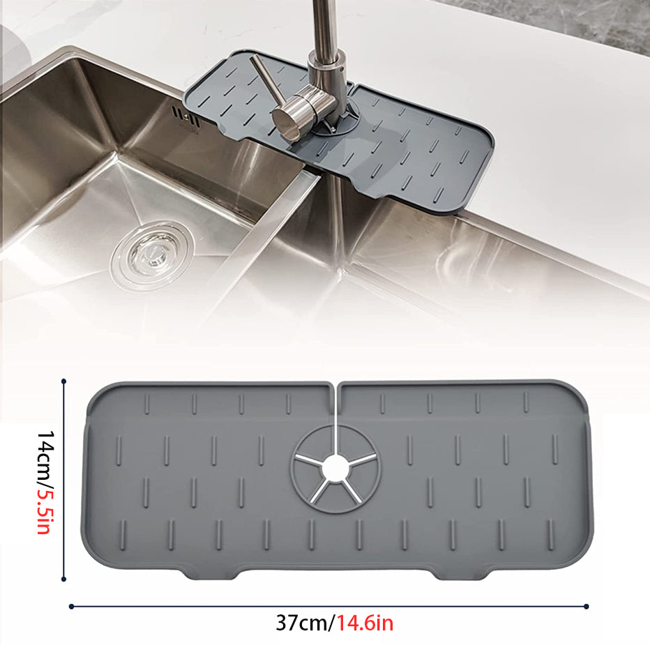 Grey kitchen faucet mat with central drain wheel and raised drip ridges