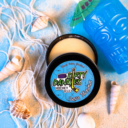 Round hockey wax tin with pale yellow wax and black lid with Dirty Dangles graphic