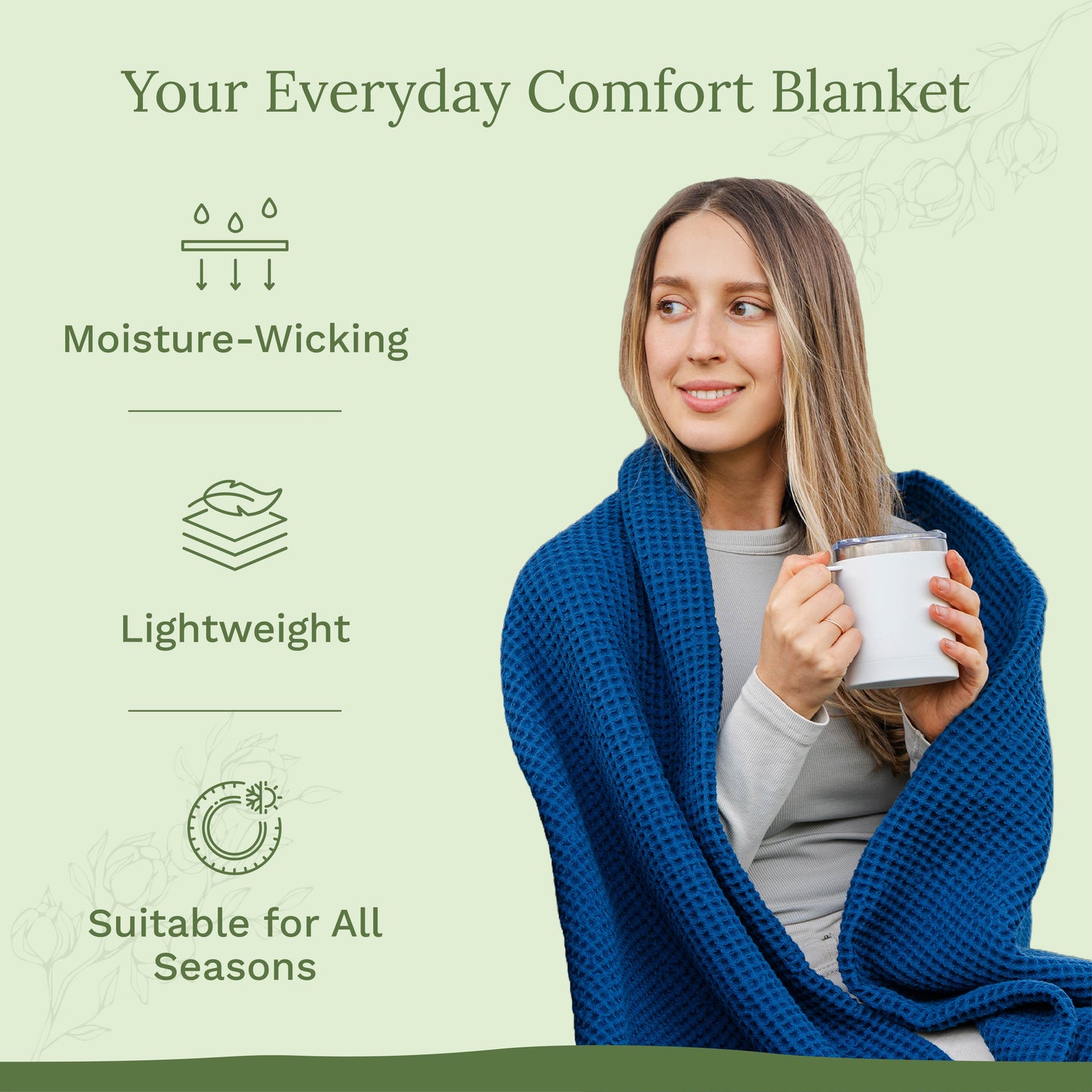 Blue waffle-weave blanket draped over a woman, held with a mug
