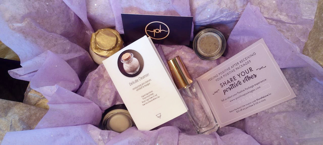 Skincare gift set flat lay with jars, tubes, and printed instruction cards