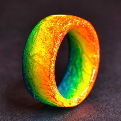 Luminous ring with orange and rainbow green-yellow glow finish