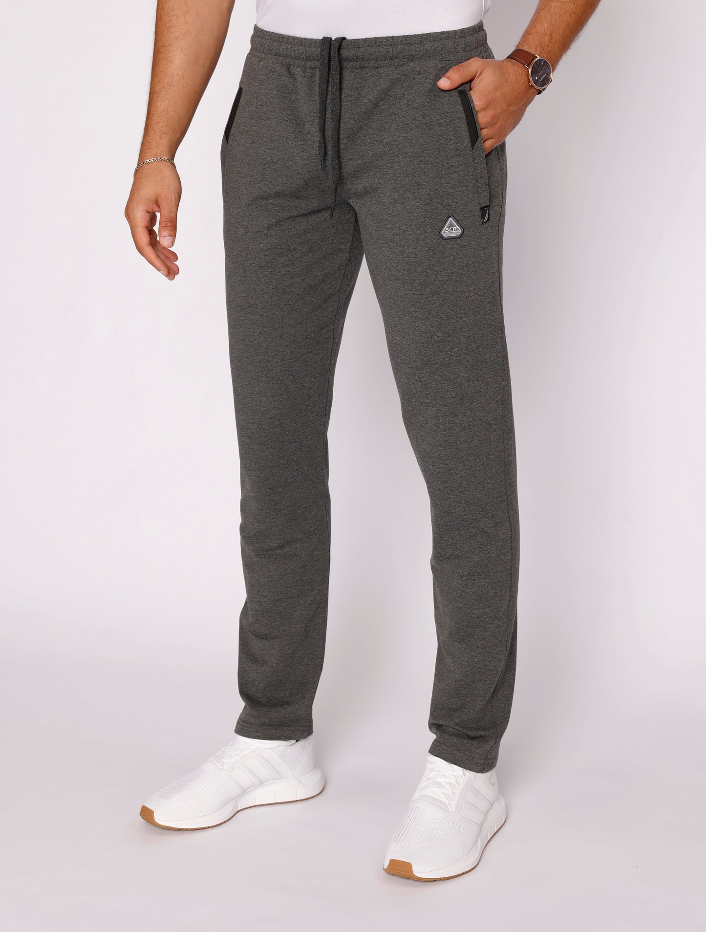 Heather grey athletic sweatpants with elastic waistband, drawstring, and tapered leg fit