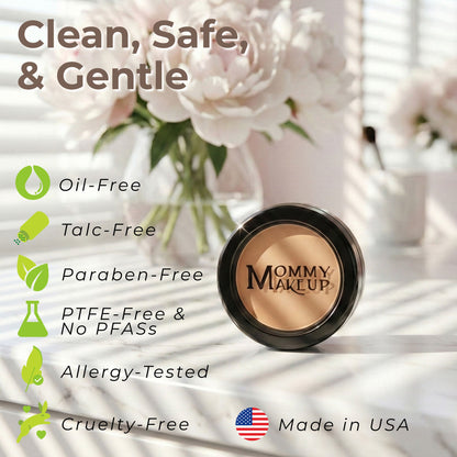 Concealer compact with light beige cream in a black circular lid