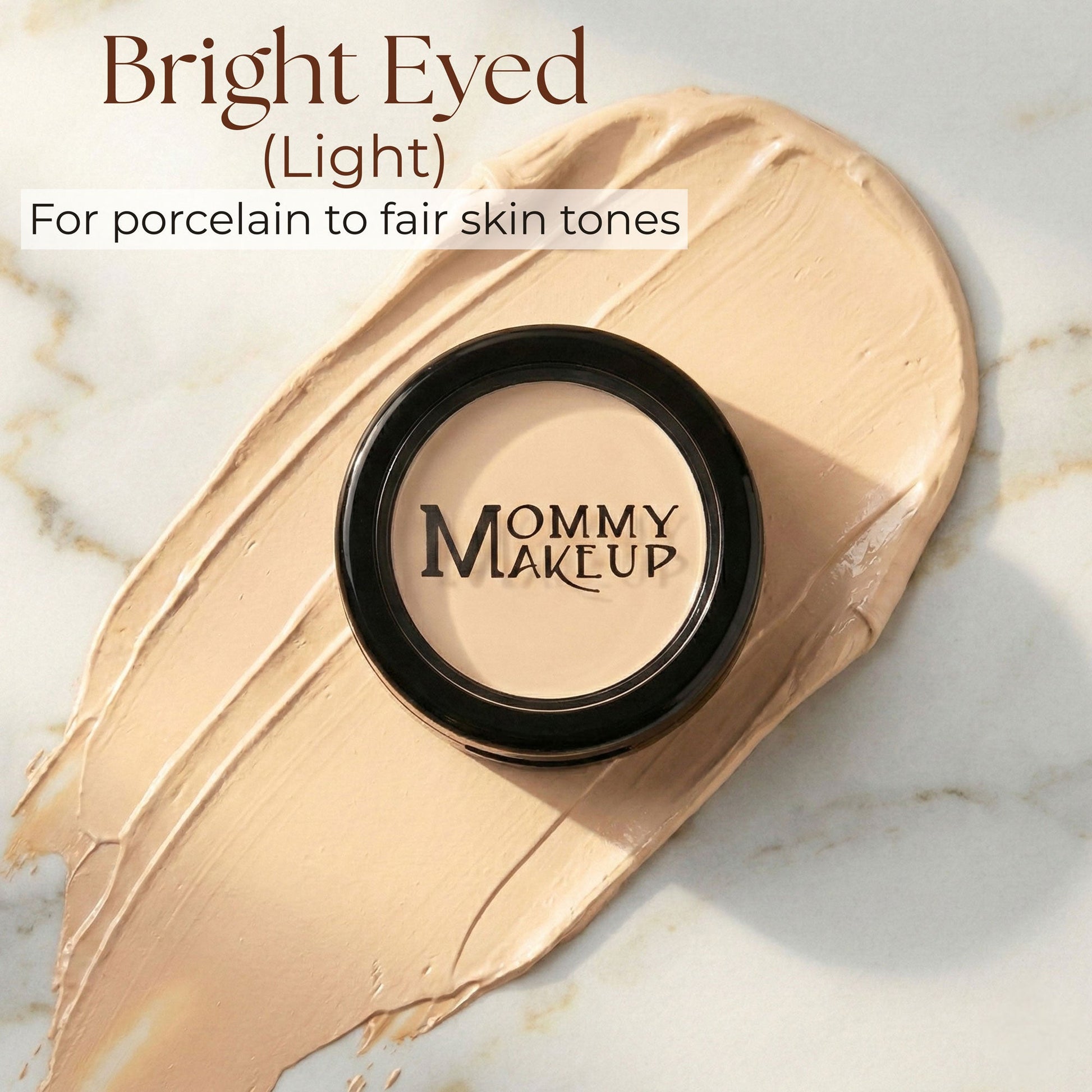 Concealer compact with light beige formula on a cream makeup swatch