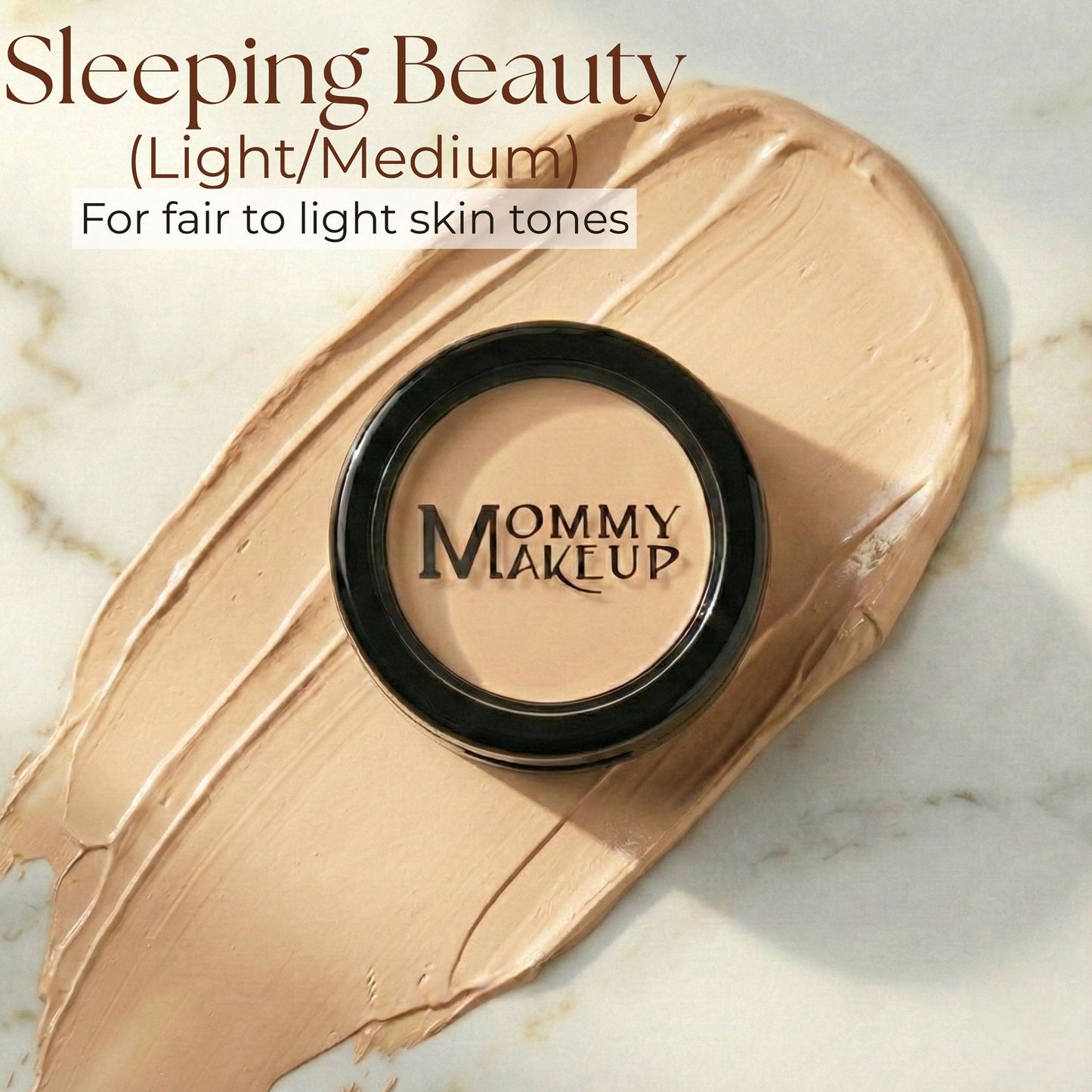 Concealer compact with light tan cream in a smear, featuring black outer ring.